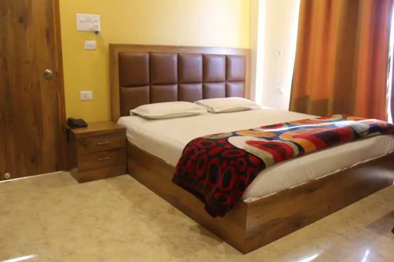 First Room bed, television and wardrobe.