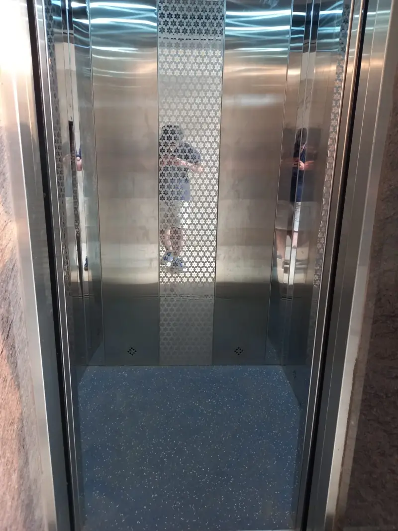 Elevator interior at Hotel RK Inn.